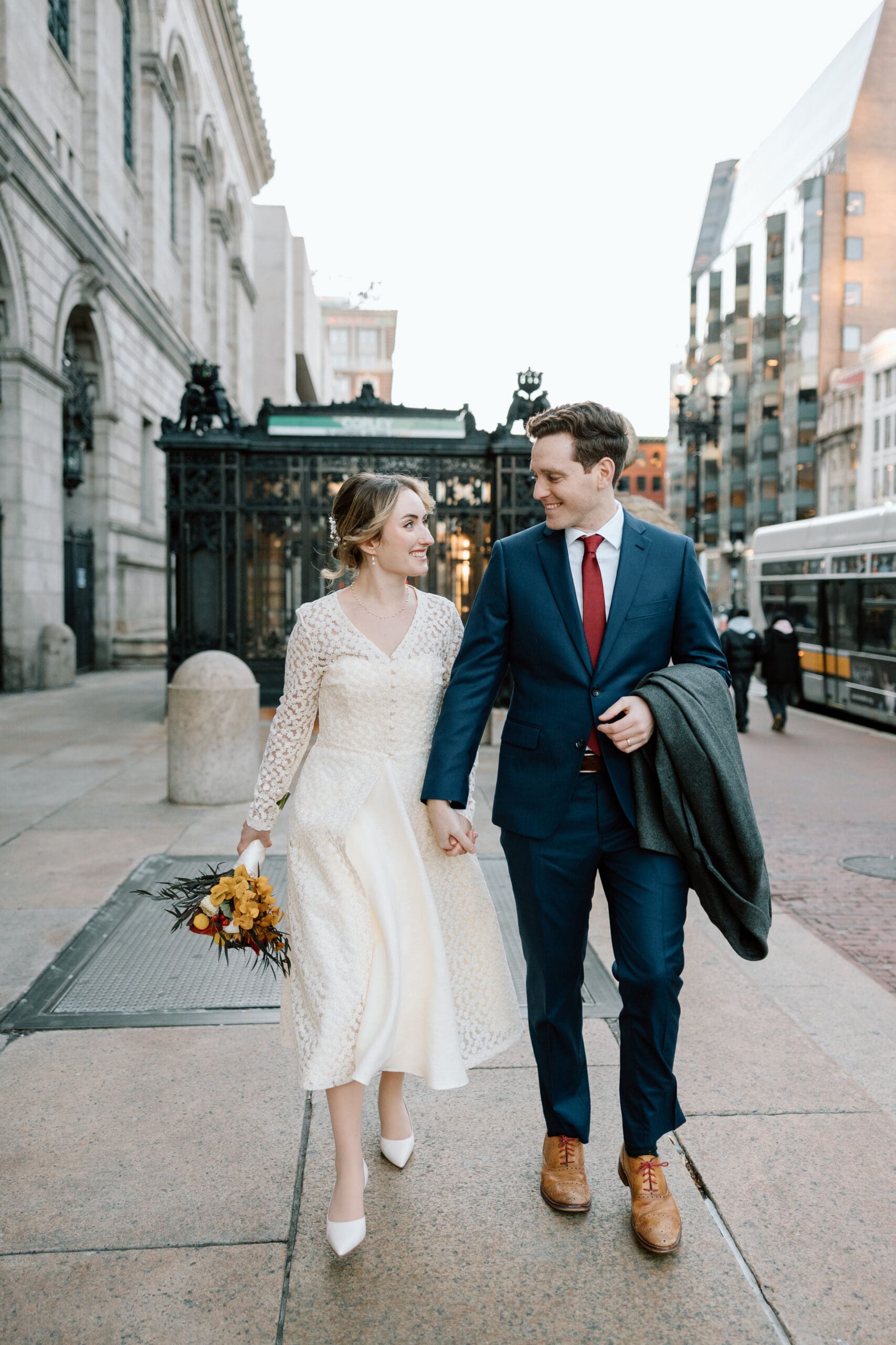couple walking from the T in Boston to Boston Public Library
